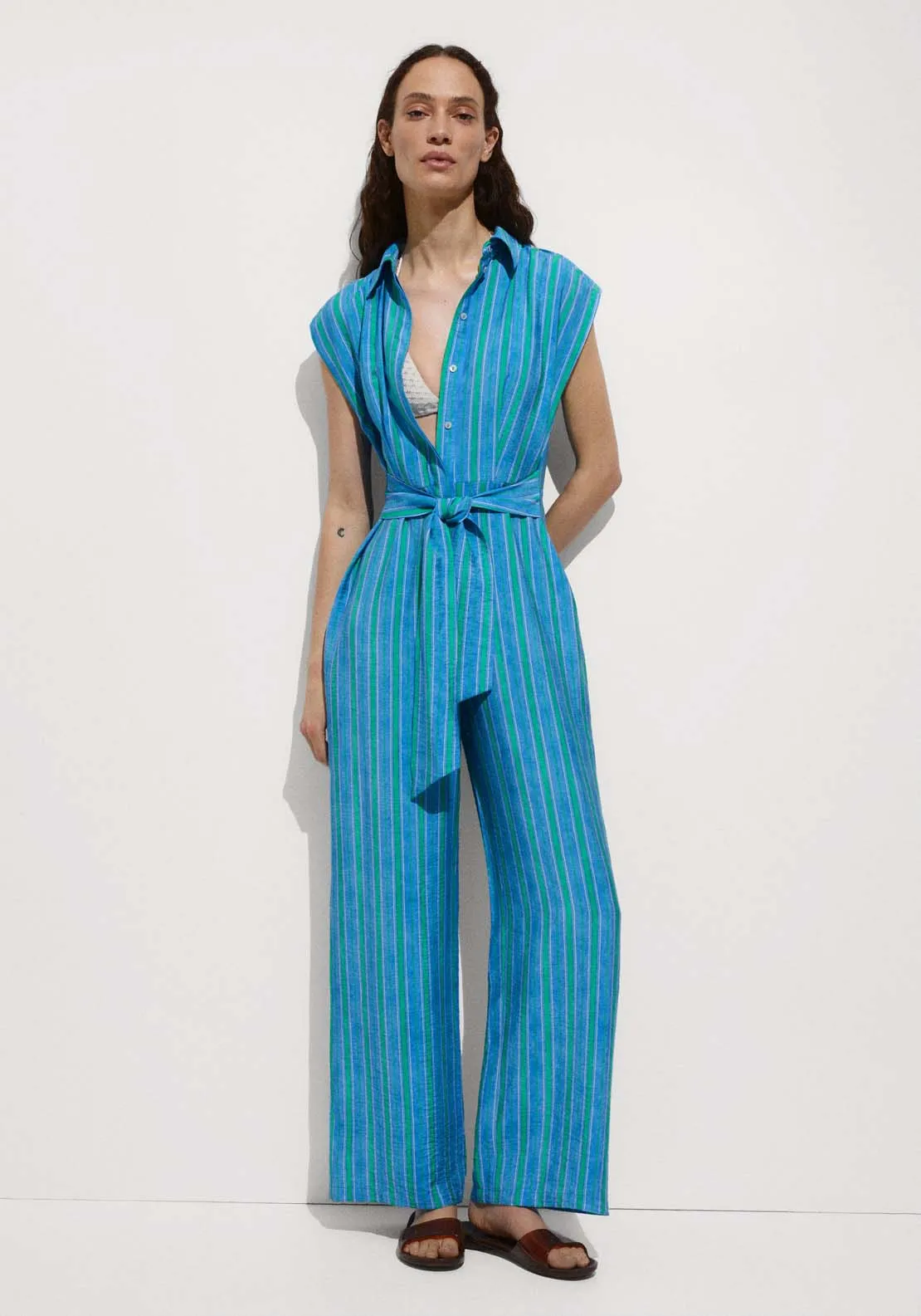 Shirt jumpsuit featuring a charming bow.