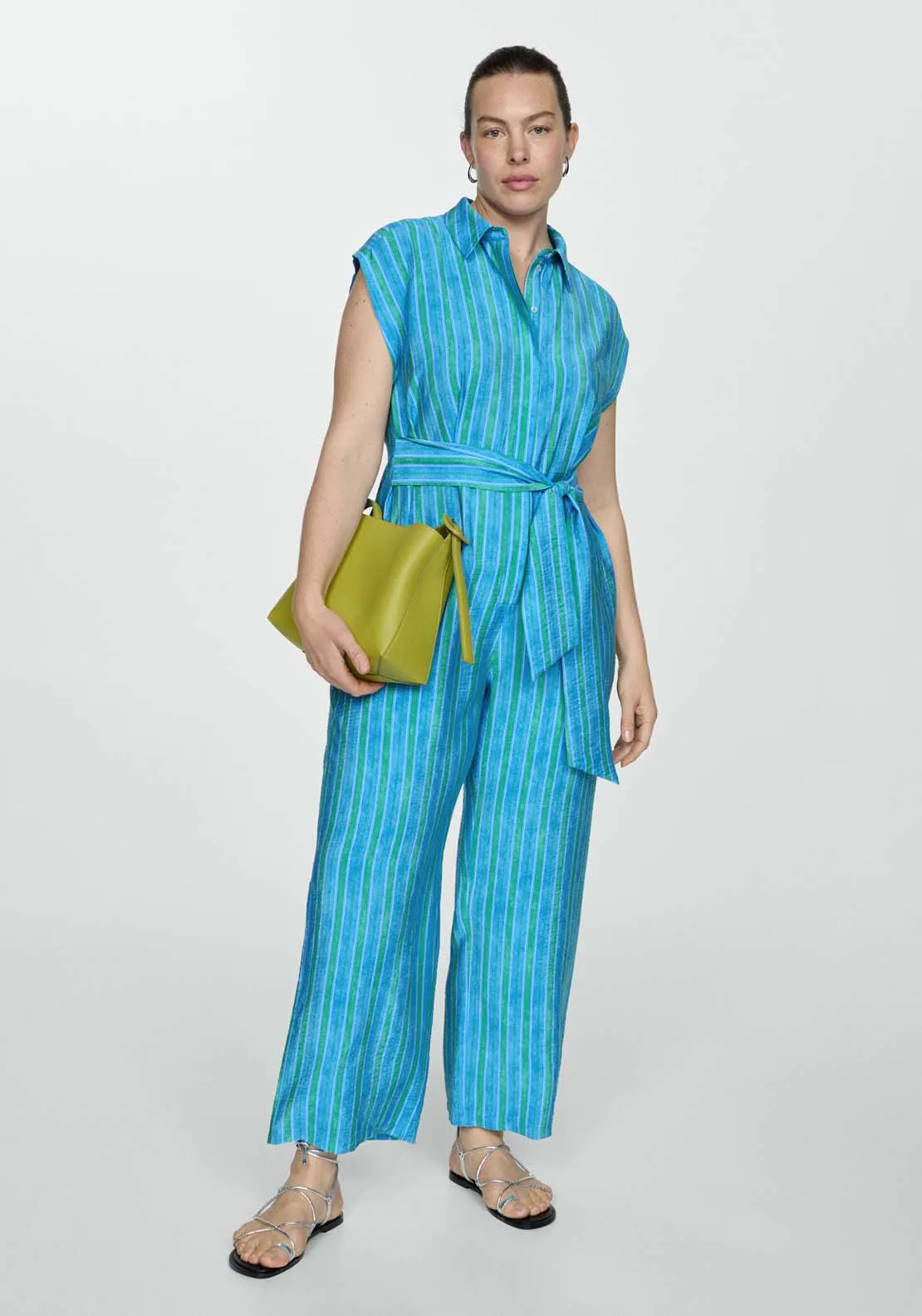 Shirt jumpsuit featuring a charming bow.