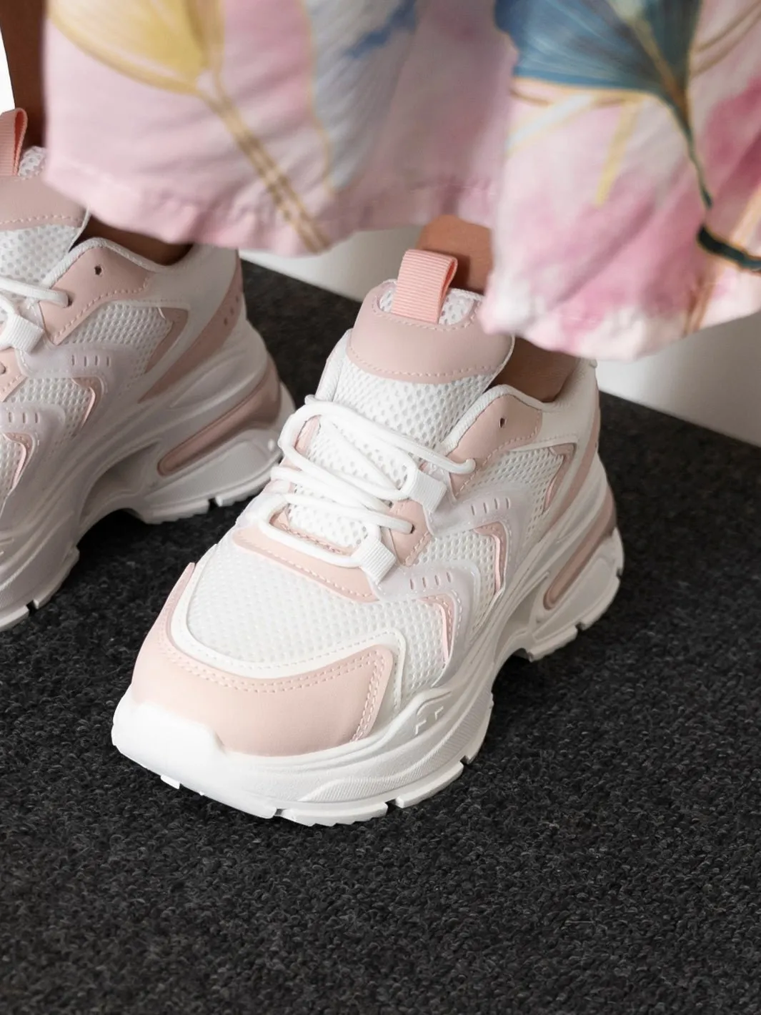 White and pink Raven sneakers.