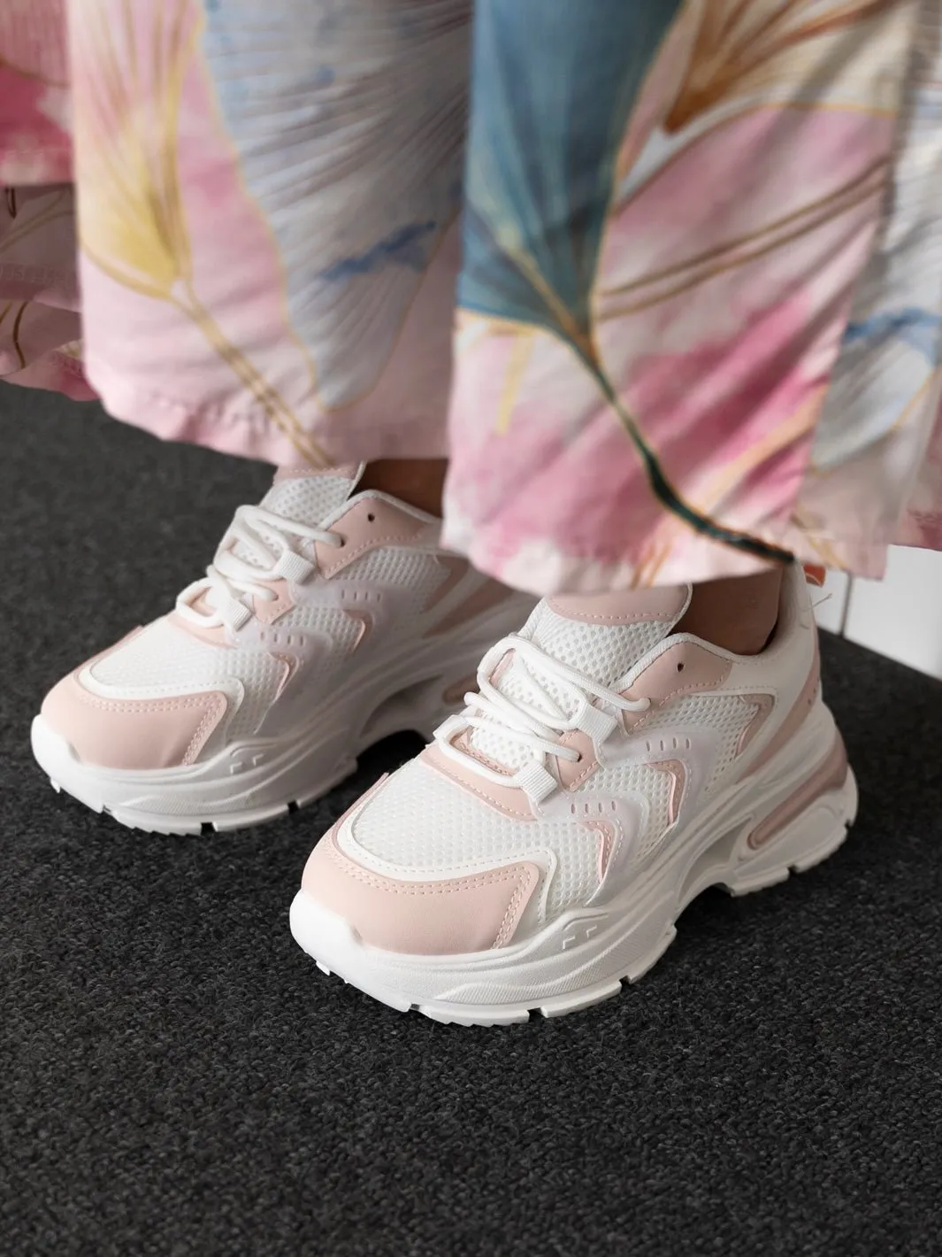 White and pink Raven sneakers.