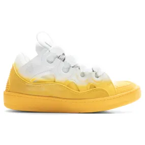 Yellow and white curb sneakers